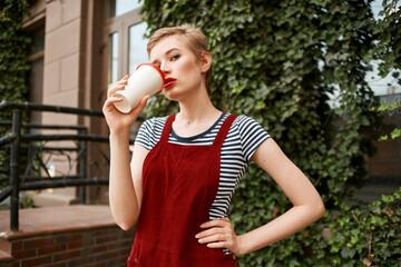 cute short haired woman cup of coffee outdoors fun