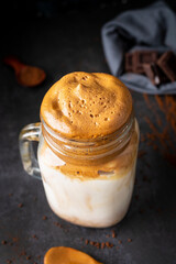 
Dalgona coffee, a refreshing coffee drink perfect for summer days. Coffee, milk, sugar and ice. Drink photography