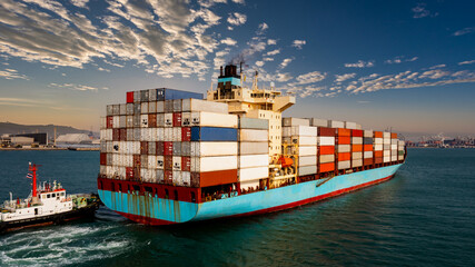 container cargo ship carrying commercial container in import export business commerce logistic and...