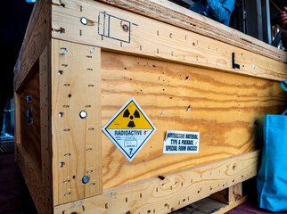 Radiation label beside the transport wooden box Type A package