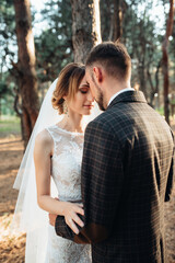walk of the bride and groom through the autumn forest