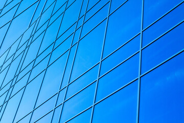 glazed facade. glazed facade against a blue background. modern skyscrapers of downtown.