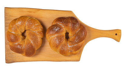 Portuguese traditional Easter cake. Folar with eggs on wooden table. Sweet bread isolated on white background