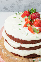Red velvet cake on wood board. Strawbwrry cake. Devils cake. Wedding dessert. Birthday party. Delicious dessert. Traditional american dessert.