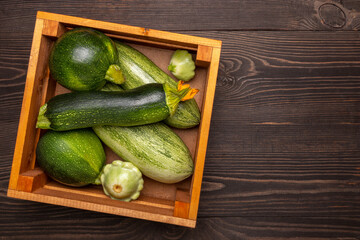 zucchini in a box on a wooden table