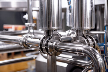 Fototapeta premium Pipes and fittings at a craft modern brewery