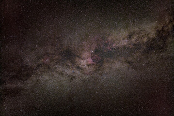 Night sky, many stars with milky way around Vulpecula and Cygnus constellation, Milky way galaxy with North America nebula visible. Long exposure stacked photo
