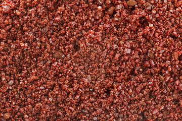 Small red crystals of thymol blue, reddish brown crystalline powder is used as pH indicator. Photo with 4x microscope magnification, image width = 9mm