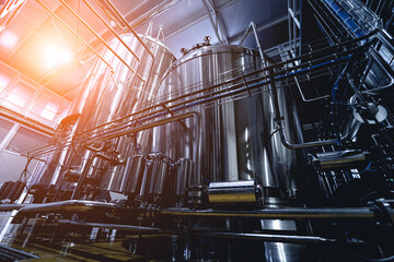 Rows of steel tanks for beer fermentation and maturation in a craft brewery