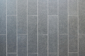 Dark gray granite tiles pattern texture background.