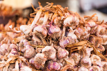 Stack of garlics on a market stall