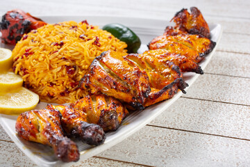 A view of a plate of Cornish game hen kabob and barberry rice.
