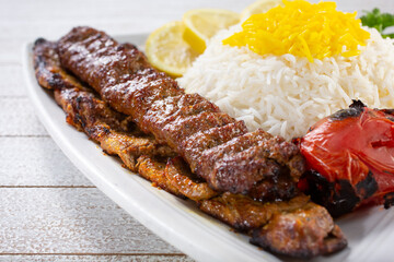 A view of combo filet mignon steak and beef soltani kabob, with saffron basmati rice.