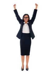 Winner mixed race asian/caucasian woman celebrating success with arms up Isolated on white background