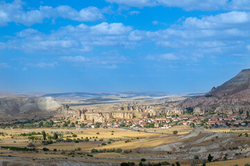 Panorama of unique geological formations in Cappadocia, Turkey. Cappadocian Region with its valley, canyon, hills located between the volcanic mountains Erciyes, Melendiz and Hasan