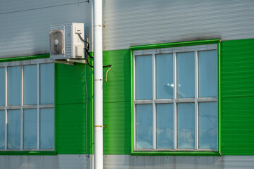 Outdoor air conditioner unit on the wall of a factory or factory. The outer wall of the enterprise...