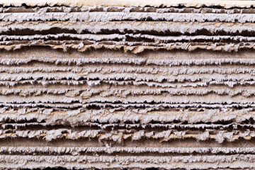 paper corrugated cardboard for packing. abstract texture background horizontal lines with beige colour. pattern