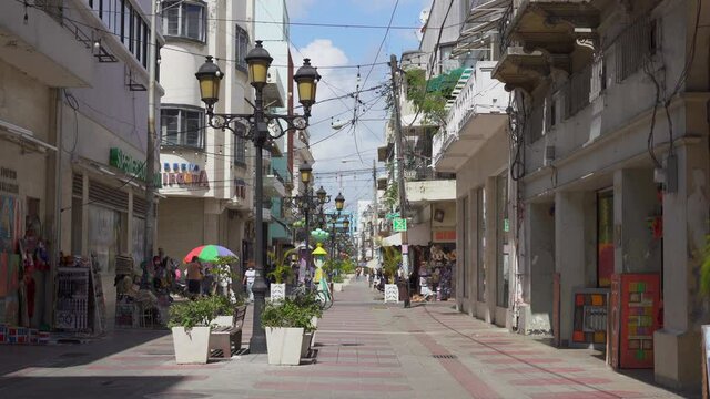 Dominican Republic, Santo Domingo - August 7, 2021: El Conde street, most popular pedestrian shopping area for tourists and guests of the capital in Colonial Zone