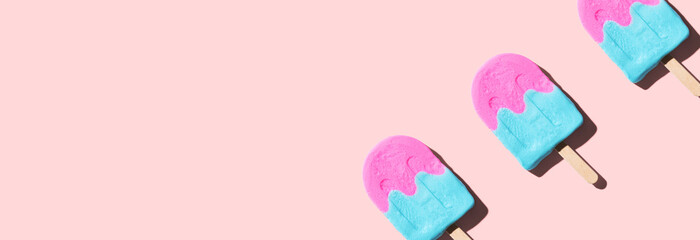 Pink and blue popsicles with shadow