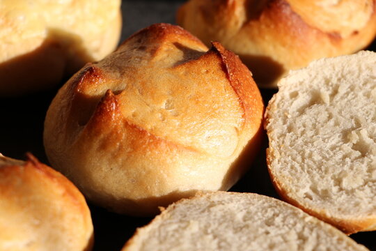 Fresh golden crusty rolls from the oven, close up