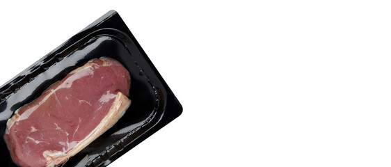 Fresh raw beef steak on black plastic tray isolated white background with clipping path
