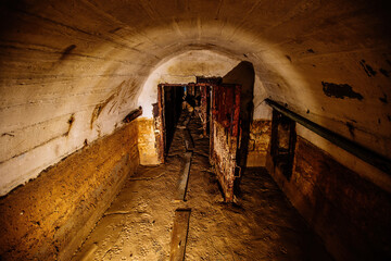Rusted metal armored door in old abandoned dirty Soviet bunker