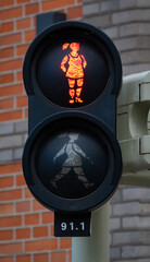 Pedestrian traffic light showing a woman sign in Maastricht, Netherlands