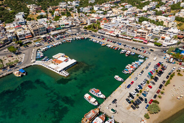 ELOUNDA, CRETE/GREECE - JULY 16 2021: Aerial view of the port and resort town of Elounda on the Greek island of Crete