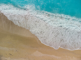 Fototapeta na wymiar Drone shot of the waves crashing from the beautiful Egremni beach in Lefkada, Greece. 