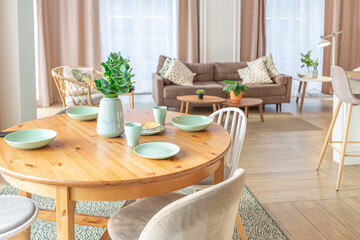 modern expensive luxurious open-plan apartment. Rich Scandinavian-style interior with wooden beams on the ceiling in pastel colors