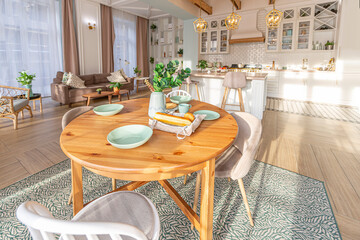 modern expensive luxurious open-plan apartment. Rich Scandinavian-style interior with wooden beams on the ceiling in pastel colors