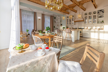 modern expensive luxurious open-plan apartment. Rich Scandinavian-style interior with wooden beams on the ceiling in pastel colors