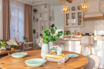 modern expensive luxurious open-plan apartment. Rich Scandinavian-style interior with wooden beams on the ceiling in pastel colors