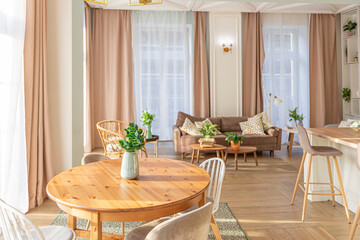 modern expensive luxurious open-plan apartment. Rich Scandinavian-style interior with wooden beams on the ceiling in pastel colors