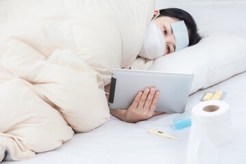 Woman patient examines body temperature during consultation with smart doctor. Sick woman in bed...