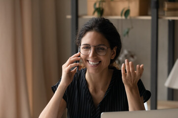 Close up smiling woman in glasses making phone call, talking, holding smartphone, friendly businesswoman consulting client, happy young female chatting with friend or boyfriend, pleasant conversation