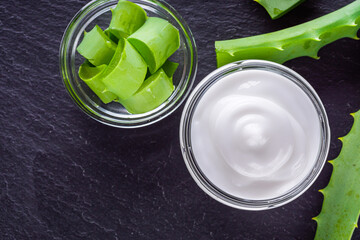 natural aloe vera cream on a dark stone background
