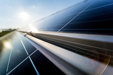 Photovoltaic solar panels on blue sky background