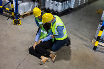 Coworker helping another who collapse on the ground due to accident and personal illness for safety...