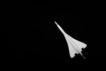 white plane isolated on black background