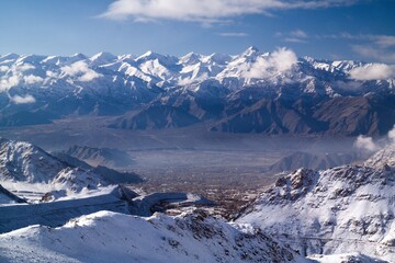 View of Stok Kangri range (6153 m) above Leh (3500 m) - obrazy, fototapety, plakaty