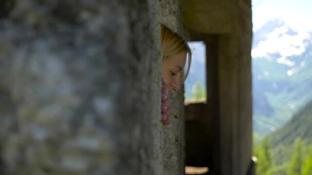 girl looking through the window