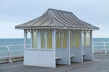 A Traditional Seaside Shelter on a Coastal Pier.