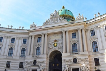 Fototapeta na wymiar The dome of the Hofburg palace in St. Michael square (Michaelerplatz), Vienna, Austria.