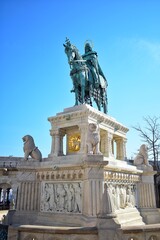Obraz premium Statue of St Stephen represents the first king of Hungary seated on a destrier, wearing the Hungarian crown and the coronation mantle.