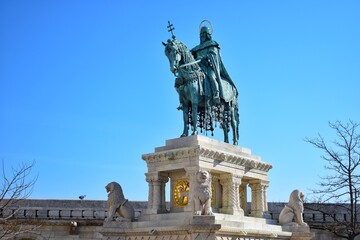 Fototapeta na wymiar Statue of St Stephen represents the first king of Hungary seated on a destrier, wearing the Hungarian crown and the coronation mantle.