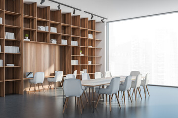 Panoramic white and grey office with bookcase and table. Corner view.