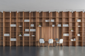 Office wall with white and grey details and floor-to-ceiling shelving © ImageFlow