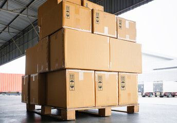 Stack of Package Boxes on Pallet at The Storage Warehouse. Shipping Warehouse Logistics Transport.