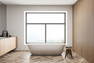 Fototapeta na wymiar Bathroom interior with white bathtub, mirror and sink
